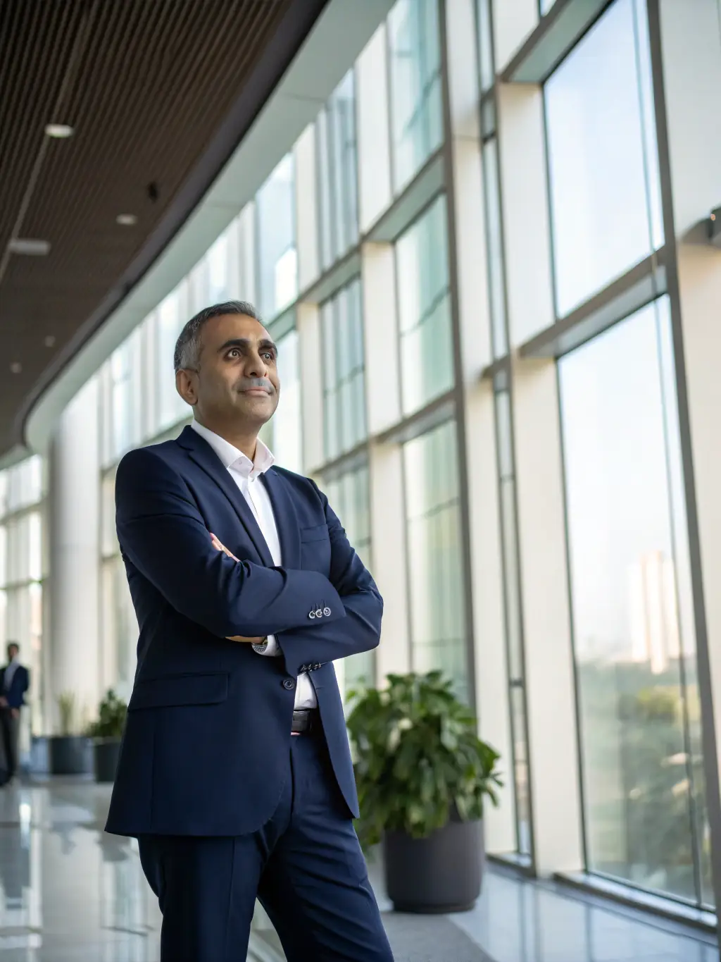 A professional in a business suit confidently leading a workshop, gesturing towards a whiteboard with career growth strategies outlined, set in a modern office environment in London.